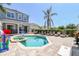 Backyard oasis featuring a sparkling pool, spa, and lounge area perfect for relaxation and entertaining at 7523 Excitement Dr, Kissimmee, FL 34747