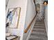Staircase with decorative elements including artwork and unique lighting at 7523 Excitement Dr, Kissimmee, FL 34747