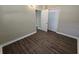 Inviting bedroom with modern floors, neutral walls, and a closet for storage, providing a calming ambiance at 5222 Montague Pl, Orlando, FL 32808