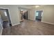 Spacious living area showcasing new floors, modern colors, and an open layout leading to the kitchen at 5222 Montague Pl, Orlando, FL 32808