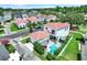 Charming home boasts a red tile roof, with a backyard oasis including a pool and meticulous landscaping in a quiet neighborhood at 740 Oak Shadows Rd, Kissimmee, FL 34747