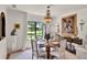 A dining room with a round table, large windows and exquisite decor at 740 Oak Shadows Rd, Kissimmee, FL 34747