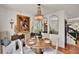 A cozy dining room with a round table, chandelier, and stylish decor at 740 Oak Shadows Rd, Kissimmee, FL 34747