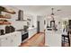Modern kitchen with white cabinets, stainless steel appliances, and stylish decor at 740 Oak Shadows Rd, Kissimmee, FL 34747