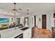 Living room features island seating, tile flooring, and an open floor plan at 740 Oak Shadows Rd, Kissimmee, FL 34747