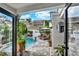 Stunning pool area with lounge chairs, lush landscaping, and privacy fence at 740 Oak Shadows Rd, Kissimmee, FL 34747