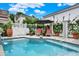 Inviting backyard pool area with lounge chairs, white privacy fence and landscaped surroundings at 740 Oak Shadows Rd, Kissimmee, FL 34747