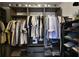 Organized walk-in closet offering shelving, safe and abundant space for storage at 740 Oak Shadows Rd, Kissimmee, FL 34747