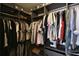 Custom walk-in closet with plenty of shelving and storage for clothing at 740 Oak Shadows Rd, Kissimmee, FL 34747
