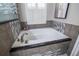 Bathroom featuring a large bathtub with tile surround at 790 Country Charm Cir, Oviedo, FL 32765