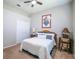 Neutral bedroom with a queen bed, simple decor, and ample closet space at 790 Country Charm Cir, Oviedo, FL 32765