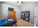 Bedroom showing an office desk with decor, a bookshelf and a closet at 790 Country Charm Cir, Oviedo, FL 32765