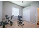 Bright bedroom featuring exercise equipment, neutral walls, and a ceiling fan at 790 Country Charm Cir, Oviedo, FL 32765