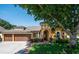 Charming single-story home with a terracotta roof, manicured landscaping and a two-car garage at 790 Country Charm Cir, Oviedo, FL 32765