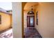 Covered front entryway showcasing a red door with decorative glass and brick paver flooring at 790 Country Charm Cir, Oviedo, FL 32765