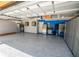 Spacious two-car garage featuring epoxy floors and custom metal storage cabinets at 790 Country Charm Cir, Oviedo, FL 32765