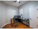 Functional home office with hardwood floors, a ceiling fan, and plenty of desk space at 790 Country Charm Cir, Oviedo, FL 32765