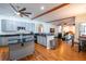 Open concept kitchen with gray cabinets, black granite countertops, and stainless steel appliances at 790 Country Charm Cir, Oviedo, FL 32765