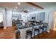 Large kitchen featuring gray cabinets, a center island, bar seating, granite countertops, and stainless steel appliances at 790 Country Charm Cir, Oviedo, FL 32765