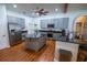 Bright kitchen features gray cabinets, stainless steel appliances, large island, and sleek granite countertops at 790 Country Charm Cir, Oviedo, FL 32765