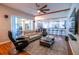 Spacious living room with hardwood floors seamlessly connects to the kitchen area at 790 Country Charm Cir, Oviedo, FL 32765