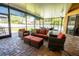 Outdoor patio featuring comfortable seating, a screened enclosure, and brick flooring at 790 Country Charm Cir, Oviedo, FL 32765