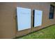 Exterior wall featuring two Tesla Powerwall units at 790 Country Charm Cir, Oviedo, FL 32765