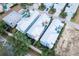 An aerial view of colorful homes, some with pools, and well-manicured lawns at 1430 Reunion Blvd, Reunion, FL 34747