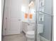 Well-lit bathroom featuring a glass shower, vanity, decorative wall art, and tiled floor at 1430 Reunion Blvd, Reunion, FL 34747