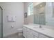 Modern bathroom featuring a white vanity with quartz countertop and glass shower at 1430 Reunion Blvd, Reunion, FL 34747