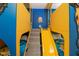 Bright bedroom featuring custom bunk beds, minion themed, with stairs and a slide at 1430 Reunion Blvd, Reunion, FL 34747
