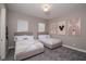 Spacious bedroom with two beds, neutral walls, and Mickey Mouse themed decor at 1430 Reunion Blvd, Reunion, FL 34747
