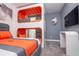 Thematic bedroom with a queen bed and custom bunkbeds, wall mounted television and modern design at 1430 Reunion Blvd, Reunion, FL 34747