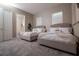 Well-lit bedroom with carpet, two beds, ensuite bathroom and ample natural light at 1430 Reunion Blvd, Reunion, FL 34747