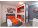 Thematic bedroom with a queen bed and custom bunkbeds, with unique wall decor at 1430 Reunion Blvd, Reunion, FL 34747