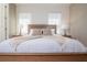 Bright bedroom with large window, featuring a comfortable bed and stylish decor for a relaxing atmosphere at 1430 Reunion Blvd, Reunion, FL 34747