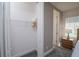 Walk-in closet with white wire shelving, neutral paint, carpeted floor and easy access to the bedroom at 1430 Reunion Blvd, Reunion, FL 34747