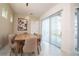 Dining room with a view of the pool through large windows at 1430 Reunion Blvd, Reunion, FL 34747