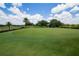 View of the expansive lush green golf course showcasing the immaculate landscaping at 1430 Reunion Blvd, Reunion, FL 34747