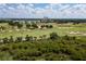 Expansive golf course with manicured greens, sand traps, and mature trees, perfect for golf enthusiasts at 1430 Reunion Blvd, Reunion, FL 34747