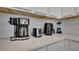 Clean kitchen countertop with modern appliances including a coffee maker, toaster, air fryer, and blender at 1430 Reunion Blvd, Reunion, FL 34747