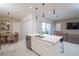 Modern kitchen island opens to the living room and dining area at 1430 Reunion Blvd, Reunion, FL 34747