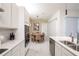 Well-lit kitchen with modern appliances adjacent to the dining area at 1430 Reunion Blvd, Reunion, FL 34747