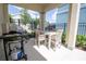 Outdoor dining area with a grill, offering a perfect space for summer BBQs and relaxation at 1430 Reunion Blvd, Reunion, FL 34747
