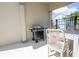 Cozy patio area with a barbecue grill and comfortable seating, ideal for outdoor entertaining at 1430 Reunion Blvd, Reunion, FL 34747