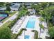 Relaxing swimming pool area with comfortable seating, manicured landscaping, and resort-style amenities at 1430 Reunion Blvd, Reunion, FL 34747