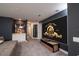 Spacious entertainment room designed as a theater with movie decor and tiered seating arrangement at 1430 Reunion Blvd, Reunion, FL 34747
