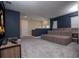 Home theater featuring tiered seating, projector, and built-in speakers, providing the ultimate viewing experience at 1430 Reunion Blvd, Reunion, FL 34747