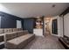 Comfortable home theater featuring tiered seating, gray walls, and decorative accents for entertainment at 1430 Reunion Blvd, Reunion, FL 34747