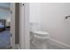 View into the toilet room, which has a standard toilet, from the Primary bedroom at 1430 Reunion Blvd, Reunion, FL 34747